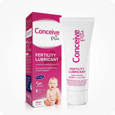 Conceive Plus Fertility Lubricant 75ml product image featuring white tube with pink vertical logo and original retail box of 75ml fertility lubricant in matching colors, showing sperm-friendly claims, pH-balanced symbol, and 75ml size on a white background.