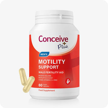 For Conceive Plus Motility and Ovulation Support Bundle, Men's Motility Support bottle in bold red and white packaging, labeled with male fertility aid benefits and 60 vegan capsules, with two yellowish capsules placed diagonally near base on a light backdrop.