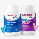 Conceive Plus Fertility Support Bundle for Him and Her featuring two side-by-side supplement bottles—blue for men and purple for women—with matching capsules displayed in foreground, clearly labeled for male reproductive health and conception multivitamin support.