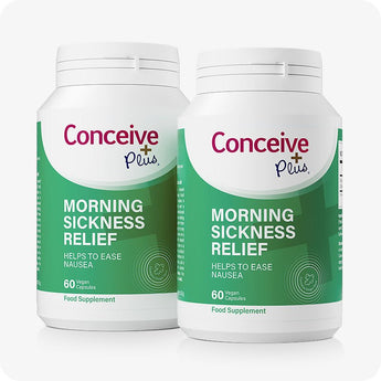 Conceive Plus Morning Sickness Relief twin pack featuring two green and white bottles, each containing 60 vegan capsules designed to ease nausea, with product branding and supplement information displayed on front.