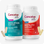 Two Conceive Plus supplement bottles, one for women's ovulation support and one for men's motility support, on a white background.