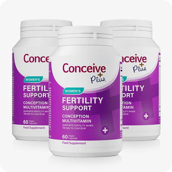 For Conceive Plus Women's Fertility Support and Ovulation Support Bundle, a triple pack of Women's Fertility Support bottles, each with 60 vegan capsules in bold purple packaging, arranged in a triangular formation to highlight multi-month supply and value offering.